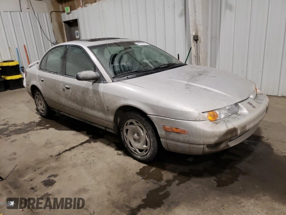 2000 Saturn SL with VIN 1G8ZK5273YZ239987, listed as a Copart auction lot 41577615 with 145,659 mi miles and Salvage title. Bid and sale history available at DreamBid. Image 4.