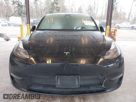 2023 Tesla Model Y Long Range with VIN 7SAYGAEEXPF707503, listed as a IAAI auction lot 41712166 with 27,467 mi miles and . Bid and sale history available at carsss.com. Image 12.