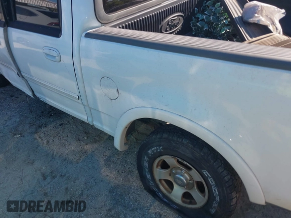 2002 Ford F-150 XLT with VIN 1FTRW08612KD90354, listed as a IAAI auction lot 41308528 with 207,261 mi miles. Bid and sale history available at carsss.com. Image 14.
