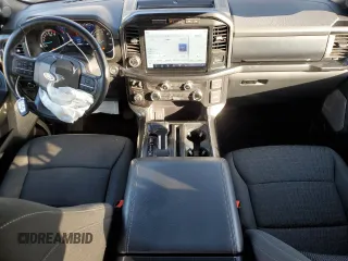 2021 Ford F-150 XL with VIN 1FTFW1E55MFA77310, listed as a Copart auction lot 56179055 with 48,990 mi miles and Salvage title. Bid and sale history available at DreamBid. Image 8.