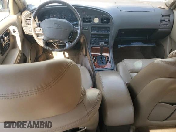 1994 Infiniti Q45 z VIN JNKNG01D3RM252218, wystawiony jako Copart lot #55309475 z przebiegiem 69 073 mil mil oraz Czysty tytuł • Clean title. Historia ofert i sprzedaży dostępna na DreamBid. Obrazek 8.