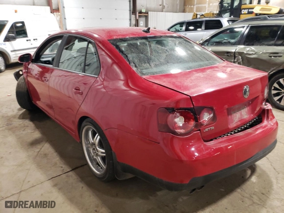 2008 Volkswagen Jetta Sedan Wolfsburg with VIN 3VWRJ71K08M136793, listed as a Copart auction lot 77232034 with 143,322 mi miles and Salvage Title. Bid and sale history available at carsss.com. Image 2.
