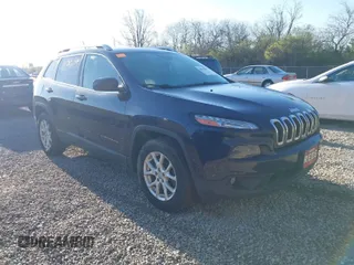 2015 Jeep Cherokee Latitude with VIN 1C4PJMCB1FW709560, listed as a IAAI auction lot 42035619 with 162,354 mi miles. Bid and sale history available at carsss.com. Image 1.