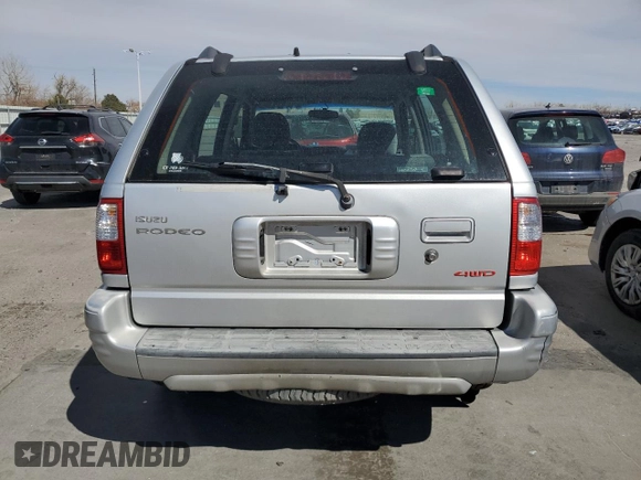 2000 Isuzu Rodeo z VIN 4S2DM58W8Y4331154, wystawiony jako Copart lot #49507535 z przebiegiem 198 476 mil mil oraz Szkody całkowita. Historia ofert i sprzedaży dostępna na DreamBid. Obrazek 6.