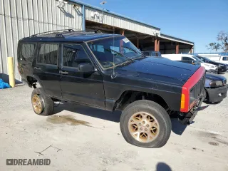2000 Jeep Cherokee Police with VIN 1J4FF48S1YL246243, listed as a Copart auction lot 84954674 with 0 mi miles and Salvage Title. Bid and sale history available at carsss.com. Image 4.