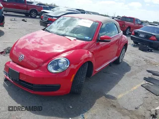 2015 Volkswagen Beetle 1.8T w/Tech with VIN 3VW517AT4FM803238, listed as a IAAI auction lot 41812373 with 42,369 mi miles and . Bid and sale history available at DreamBid. Image 2.