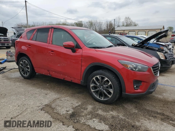 2016 Mazda CX-5 Grand Touring with VIN JM3KE4DY5G0660201, listed as a Copart auction lot 52165205 with 108,231 mi miles and Salvage Title. Bid and sale history available at DreamBid. Image 4.