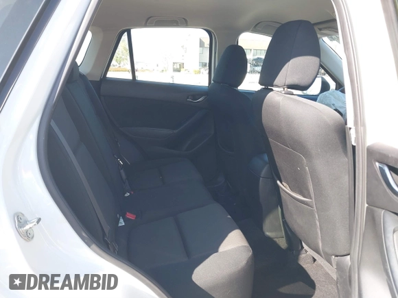 2016 Mazda CX-5 Sport with VIN JM3KE2BY9G0879654, listed as a IAAI auction lot 41819154 with 65,586 mi miles. Bid and sale history available at carsss.com. Image 8.