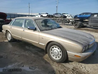 1999 Jaguar XJ with VIN SAJKX6040XC857312, listed as a Copart auction lot 84918704 with 75,425 mi miles and Clean Title. Bid and sale history available at carsss.com. Image 4.