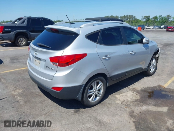 2013 Hyundai Tucson GLS with VIN KM8JU3AC3DU551018, listed as a IAAI auction lot 41988305 with 214,728 mi miles. Bid and sale history available at carsss.com. Image 4.