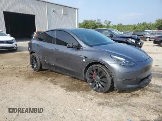 2022 Tesla Model Y Performance with VIN 7SAYGDEF4NF447462, listed as a Copart auction lot 58306595 with 61,671 mi miles and Non repairable. Bid and sale history available at DreamBid. Image 4.
