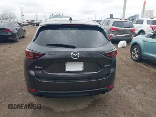 2017 Mazda CX-5 Touring with VIN JM3KFACL3H0148312, listed as a IAAI auction lot 41844634 with 68,534 mi miles and . Bid and sale history available at carsss.com. Image 16.
