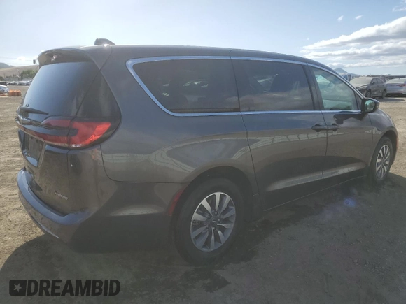 2023 Chrysler Pacifica Hybrid Touring L with VIN 2C4RC1L79PR608659, listed as a Copart auction lot 56945365 with 45,697 mi miles and Salvage title. Bid and sale history available at DreamBid. Image 3.
