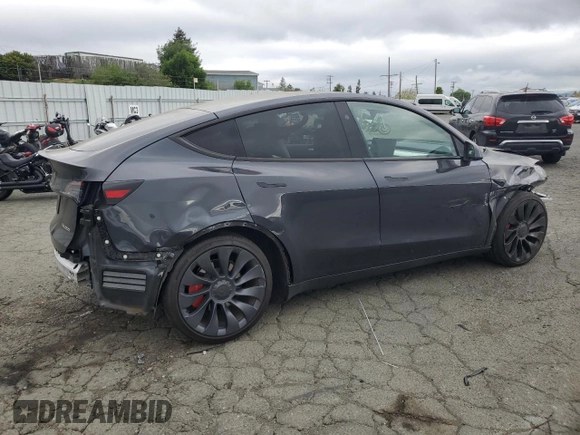 2024 Tesla Model Y Performance with VIN 7SAYGDEF7RF093054, listed as a Copart auction lot 50747985 with 26,907 mi miles and Salvage Title. Bid and sale history available at DreamBid. Image 3.