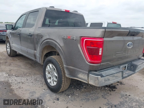 2023 Ford F-150 XL with VIN 1FTFW1E81PFB71702, listed as a IAAI auction lot 42102699 with 57,007 mi miles. Bid and sale history available at carsss.com. Image 3.