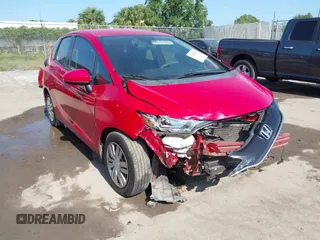 2017 Honda Fit LX z VIN 3HGGK5H55HM711676, wystawiony jako IAAI lot #42043253 z przebiegiem 118 285 mil mil oraz . Historia ofert i sprzedaży dostępna na DreamBid. Obrazek 1.