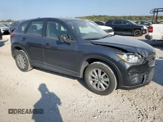2016 Mazda CX-5 Sport with VIN JM3KE2BE7G0739544, listed as a Copart auction lot 75557244 with 128,336 mi miles and Salvage Title. Bid and sale history available at DreamBid. Image 4.