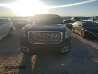 2015 GMC Yukon Denali with VIN 1GKS1CKJ7FR132677, listed as a Copart auction lot 82118584 with 144,798 mi miles and Salvage Title. Bid and sale history available at carsss.com. Image 5.