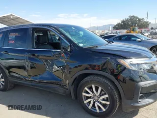 2020 Honda Pilot EX-L with VIN 5FNYF5H54LB009448, listed as a IAAI auction lot 41697106 with 63,310 mi miles. Bid and sale history available at carsss.com. Image 6.