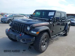 2021 Jeep Gladiator Rubicon z VIN 1C6JJTBG6ML535939, wystawiony jako IAAI lot #42260764 z przebiegiem 114 060 mil mil oraz . Historia ofert i sprzedaży dostępna na DreamBid. Obrazek 19.