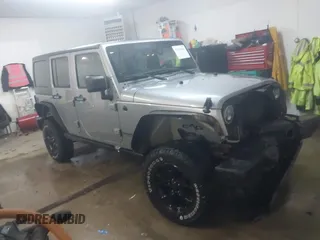 2013 Jeep Wrangler Unlimited Sport z VIN 1C4BJWDG0DL668028, wystawiony jako IAAI lot #41642586 z przebiegiem 170 438 mil mil oraz . Historia ofert i sprzedaży dostępna na DreamBid. Obrazek 1.