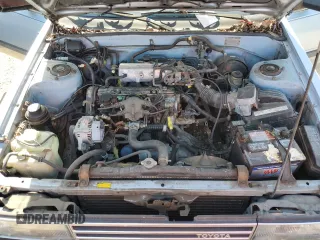 1986 Toyota Camry z VIN JT2SV12E3G6021210, wystawiony jako Copart lot #49623985 z przebiegiem 144 064 mil mil oraz Czysty tytuł • Clean title. Historia ofert i sprzedaży dostępna na DreamBid. Obrazek 11.