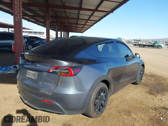 2022 Tesla Model Y Long Range with VIN 7SAYGDEE2NA017434, listed as a IAAI auction lot 41842025 with 35,164 mi miles and . Bid and sale history available at DreamBid. Image 4.
