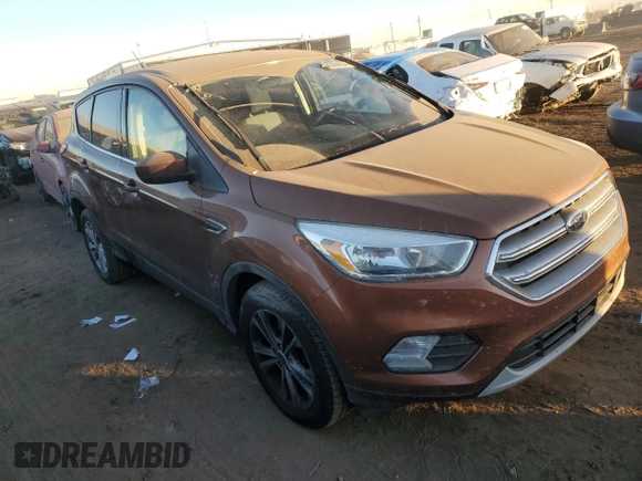 2017 Ford Escape SE with VIN 1FMCU9GD7HUE89317, listed as a Copart auction lot 83536654 with 121,939 mi miles and Clean Title. Bid and sale history available at carsss.com. Image 4.