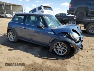 2011 MINI Hardtop S with VIN WMWSV3C57BTY13899, listed as a Copart auction lot 55802555 with 73,012 mi miles and Salvage title. Bid and sale history available at DreamBid. Image 4.