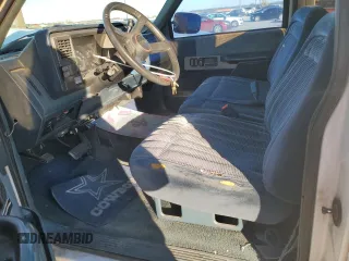 1991 GMC Sierra 1500 with VIN 2GTGC29K3M1532424, listed as a Copart auction lot 86216144 with 173,257 mi miles and Salvage Title. Bid and sale history available at DreamBid. Image 7.
