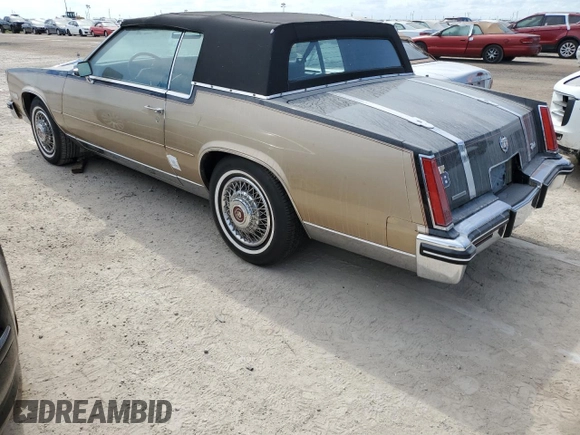 1985 Cadillac Eldorado z VIN 1G6EL578XFE614641, wystawiony jako Copart lot #75663984 z przebiegiem 54 128 mil mil oraz Szkody całkowita. Historia ofert i sprzedaży dostępna na DreamBid. Obrazek 2.