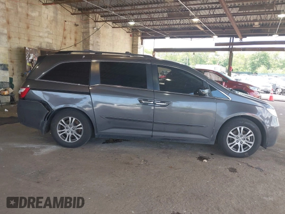 2012 Honda Odyssey EX-L with VIN 5FNRL5H67CB016934, listed as a IAAI auction lot 42405714 with 248,512 mi miles and . Bid and sale history available at DreamBid. Image 13.