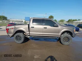 2018 Ford F-150 XL with VIN 1FTEW1EG1JFC31794, listed as a IAAI auction lot 41304111 with 129,058 mi miles and . Bid and sale history available at carsss.com. Image 13.