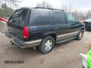 1998 GMC Yukon with VIN 1GKEK13R9WJ734112, listed as a IAAI auction lot 42072548 with 226,061 mi miles. Bid and sale history available at carsss.com. Image 4.