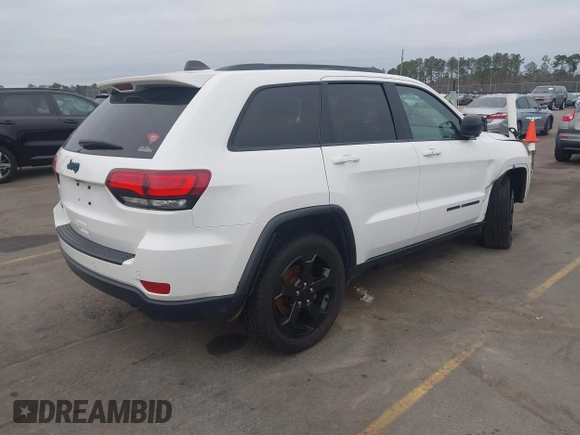 2018 Jeep Grand Cherokee Laredo E with VIN 1C4RJFAG2JC503130, listed as a IAAI auction lot 41527333 with 95,669 mi miles. Bid and sale history available at carsss.com. Image 4.