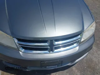 2012 Dodge Avenger SE with VIN 1C3CDZABXCN136105, listed as a IAAI auction lot 42211414 with 169,986 mi miles and . Bid and sale history available at carsss.com. Image 6.