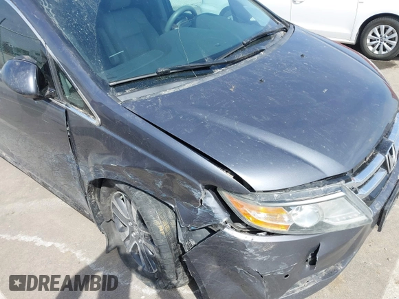 2014 Honda Odyssey Touring with VIN 5FNRL5H91EB093540, listed as a IAAI auction lot 41887412 with 202,076 mi miles and . Bid and sale history available at DreamBid. Image 21.