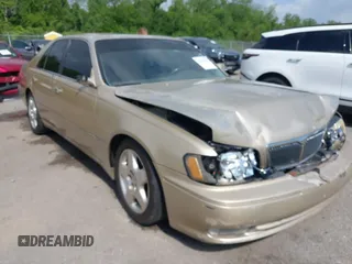 1999 Infiniti Q45 z VIN JNKBY31A2XM606315, wystawiony jako IAAI lot #42075351 z przebiegiem 166 686 mil mil oraz . Historia ofert i sprzedaży dostępna na DreamBid. Obrazek 1.