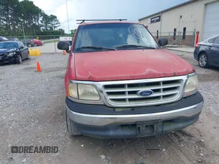 1999 Ford F-150 z VIN 1FTZX1723XNA41946, wystawiony jako IAAI lot #42255760 z przebiegiem 162 612 mil mil oraz . Historia ofert i sprzedaży dostępna na DreamBid. Obrazek 6.