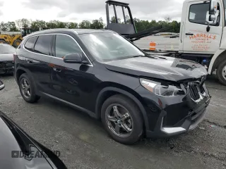 2023 BMW X1 xDrive28i with VIN WBX73EF09P5W64467, listed as a Copart auction lot 58586875 with 29,022 mi miles and Salvage title. Bid and sale history available at DreamBid. Image 4.