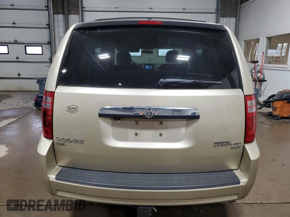2010 Dodge Grand Caravan Crew with VIN 2D4RN6DX7AR463122, listed as a Copart auction lot 48768635 with 102,497 mi miles and Salvage Title. Bid and sale history available at DreamBid. Image 6.