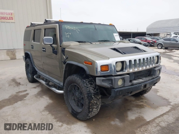 2005 Hummer H2 SUV z VIN 5GRGN23U95H132238, wystawiony jako IAAI lot #41809909 z przebiegiem 300 293 mil mil oraz . Historia ofert i sprzedaży dostępna na DreamBid. Obrazek 1.