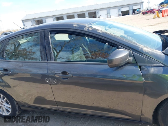 2018 Ford Focus SE z VIN 1FADP3F2XJL316101, wystawiony jako IAAI lot #40805650 z przebiegiem 53 551 mil mil oraz . Historia ofert i sprzedaży dostępna na DreamBid. Obrazek 12.