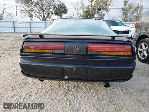 1992 Pontiac Firebird z VIN 1G2FS23T0NL203325, wystawiony jako Copart lot #76359414 z przebiegiem 198 651 mil mil oraz Nie do naprawy • Non repairable. Historia ofert i sprzedaży dostępna na DreamBid. Obrazek 6.