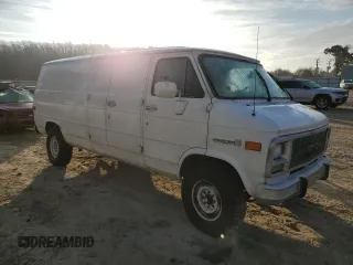 1992 GMC Vandura z VIN 2GTGG39KXN4515226, wystawiony jako Copart lot #85211254 z przebiegiem 594 809 mil mil oraz Szkody całkowita. Historia ofert i sprzedaży dostępna na DreamBid. Obrazek 4.