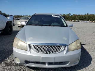 2006 Kia Spectra EX with VIN KNAFE121365229594, listed as a Copart auction lot 77311084 with 129,789 mi miles and Salvage Title. Bid and sale history available at carsss.com. Image 5.