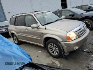 2004 Suzuki XL7 LX z VIN JS3TX92V744100442, wystawiony jako Copart lot #84847614 z przebiegiem 82 751 mil mil oraz Szkody całkowita. Historia ofert i sprzedaży dostępna na DreamBid. Obrazek 4.