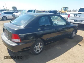 2001 Hyundai Accent GL z VIN KMHCG35C01U114597, wystawiony jako IAAI lot #42163745 z przebiegiem 203 310 mil mil oraz . Historia ofert i sprzedaży dostępna na DreamBid. Obrazek 4.