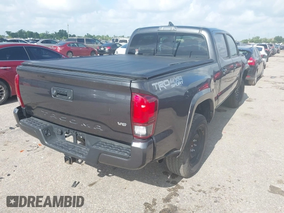 2018 Toyota Tacoma SR5 with VIN 3TMDZ5BN0JM051283, listed as a IAAI auction lot 42438690 with 106,155 mi miles and . Bid and sale history available at DreamBid. Image 4.