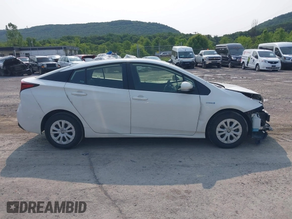 2021 Toyota Prius L Eco with VIN JTDKAMFU7M3147668, listed as a IAAI auction lot 42390394 with 80,831 mi miles and . Bid and sale history available at DreamBid. Image 14.